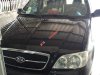 Kia Carnival GS  2006 - Cần bán xe Kia Carnival GS 2006, màu đen