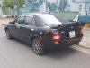 Mazda 323 1.6MT 2002 2002 - Cần bán lại xe Mazda 323 Classic đời 2002, màu đen xe gia đình, giá chỉ 200 triệu