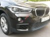 BMW X1 sDrive 20i 2015 - Bán BMW X1 sDrive 20i 24.000km model 2016, xe còn mới, không đâm đụng