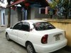 Daewoo Lanos SX 2002 - Cần bán lại xe Daewoo Lanos SX đời 2002, màu trắng