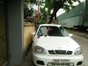 Daewoo Lanos SX 2002 - Cần bán lại xe Daewoo Lanos SX đời 2002, màu trắng