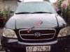 Kia Carnival   GS 2009 - Cần bán xe Kia Carnival GS năm 2009, màu đen số tự động, giá 325tr