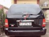 Kia Carnival   GS 2009 - Cần bán xe Kia Carnival GS năm 2009, màu đen số tự động, giá 325tr