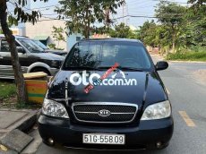 Kia Carnival 2005 - Bán Kia Carnival 2.7MT sản xuất năm 2005, màu đen, xe nhập chính chủ, 157 triệu